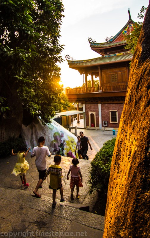 Kids at sunset at Xiamen's Nanputuo Temple.